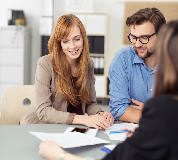 Couple Talks to Financial Advisor About Getting a Loan