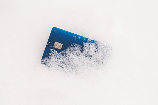 A credit card frozen in a block of ice