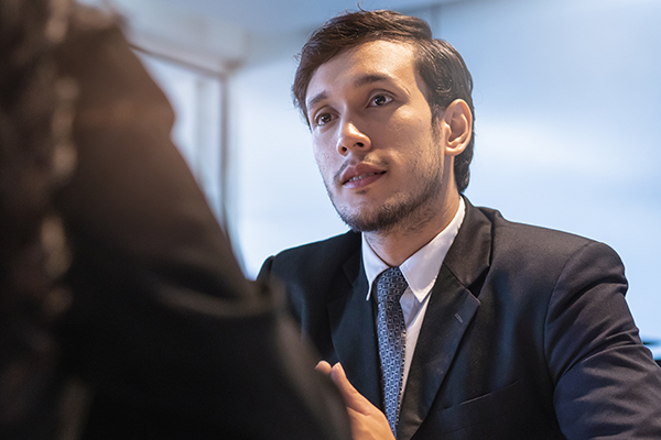 Young serious businessman wearing a business suit