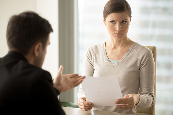 Confused woman listens to a credit counsellor