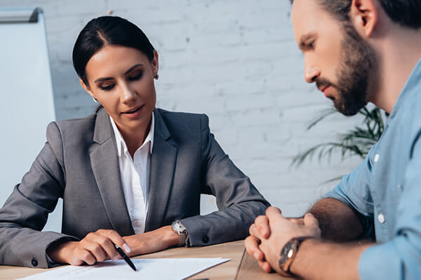 Finance professional going through bankruptcy documents with client