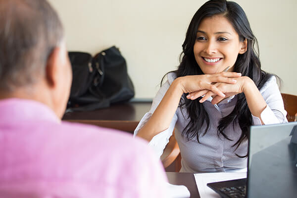 Councillor smiling to a client