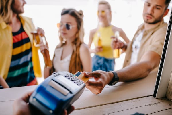 Close Up Of People Hands Moving Plastic Figurines 2025 02 17 21 45 33 Utc 1 person paying with credit card during the summer
