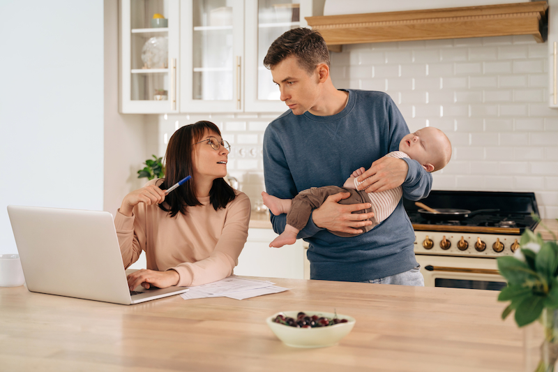 Couple With Baby Couple with baby considering finances